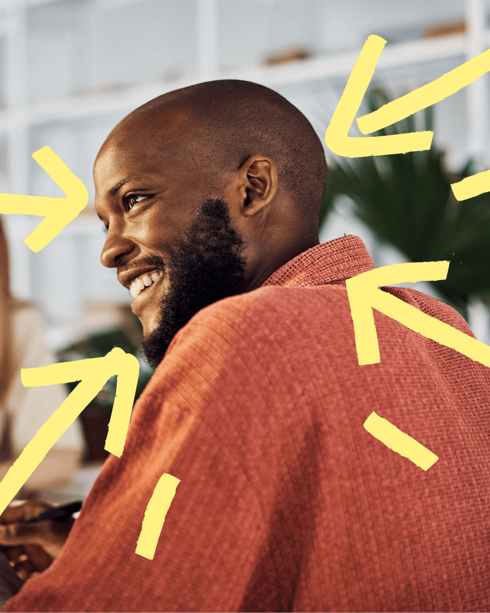 Ciphr brand — man smiling with yellow graphic arrows